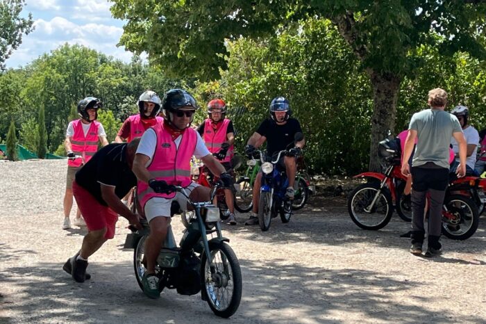 Group of cyclists gathered on a path
