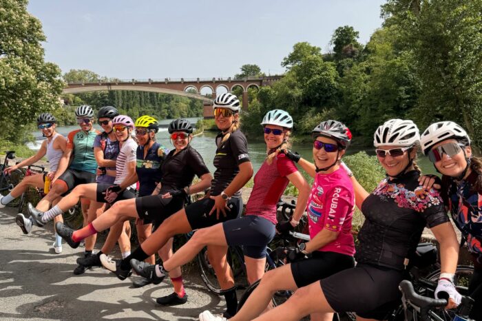 Group of cyclists taking a break at the roadside